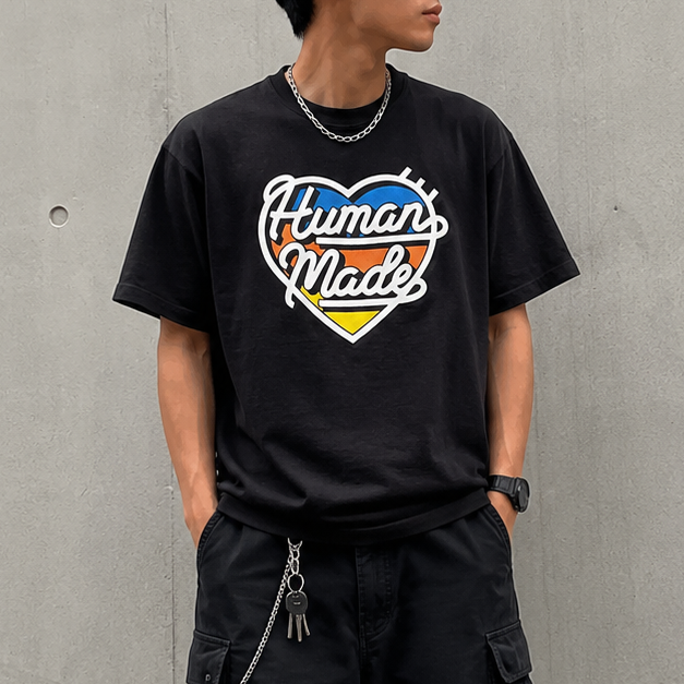 Black Human Made Tri-Color Heart Logo Tee featuring a colorful heart design on the front, casual apparel for streetwear style.