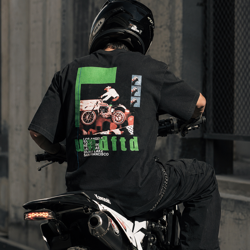 Black Undefeated Moto Tee featuring bold logo graphic, casual short-sleeve cotton T-shirt for streetwear style.