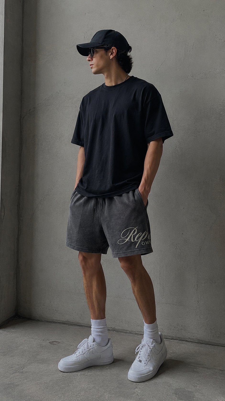 Represent Script Mesh Shorts in vintage black, showcasing lightweight fabric and stylish mesh design for casual wear.