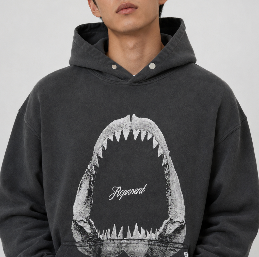 Represent Shark Jaws Hoodie Off Black, black hoodie featuring a shark jaw graphic, casual streetwear apparel from REPRESENT.
