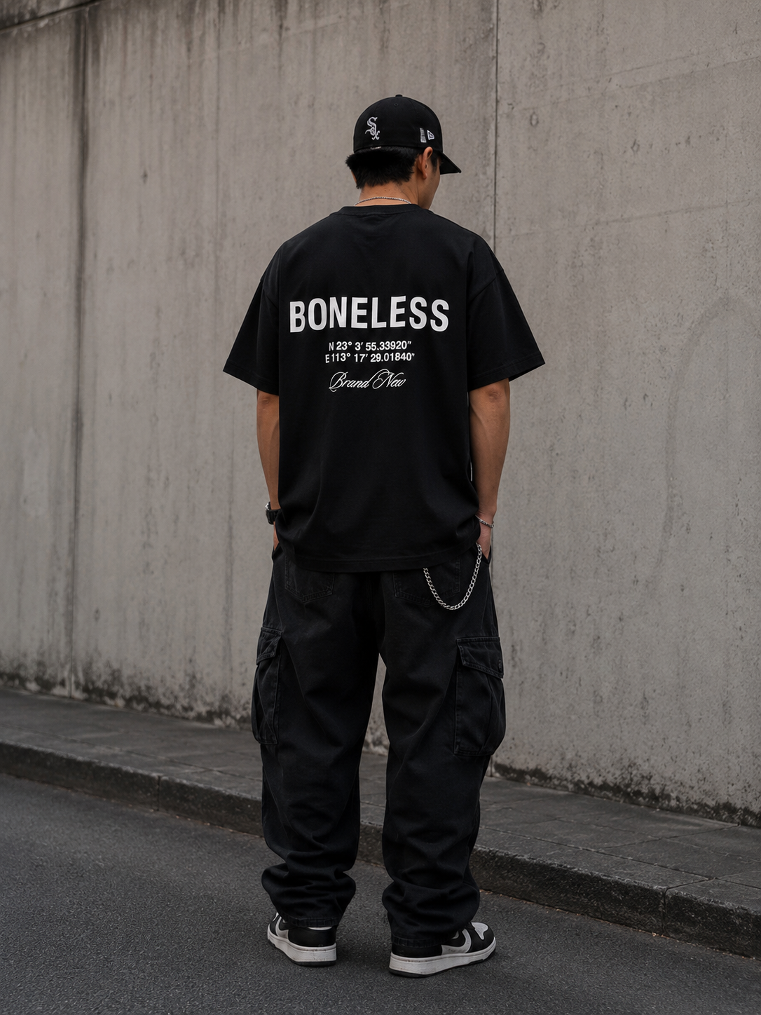 Black Boneless Coordinate Tee from BONELESS, featuring a relaxed fit and casual style, shown on a model.