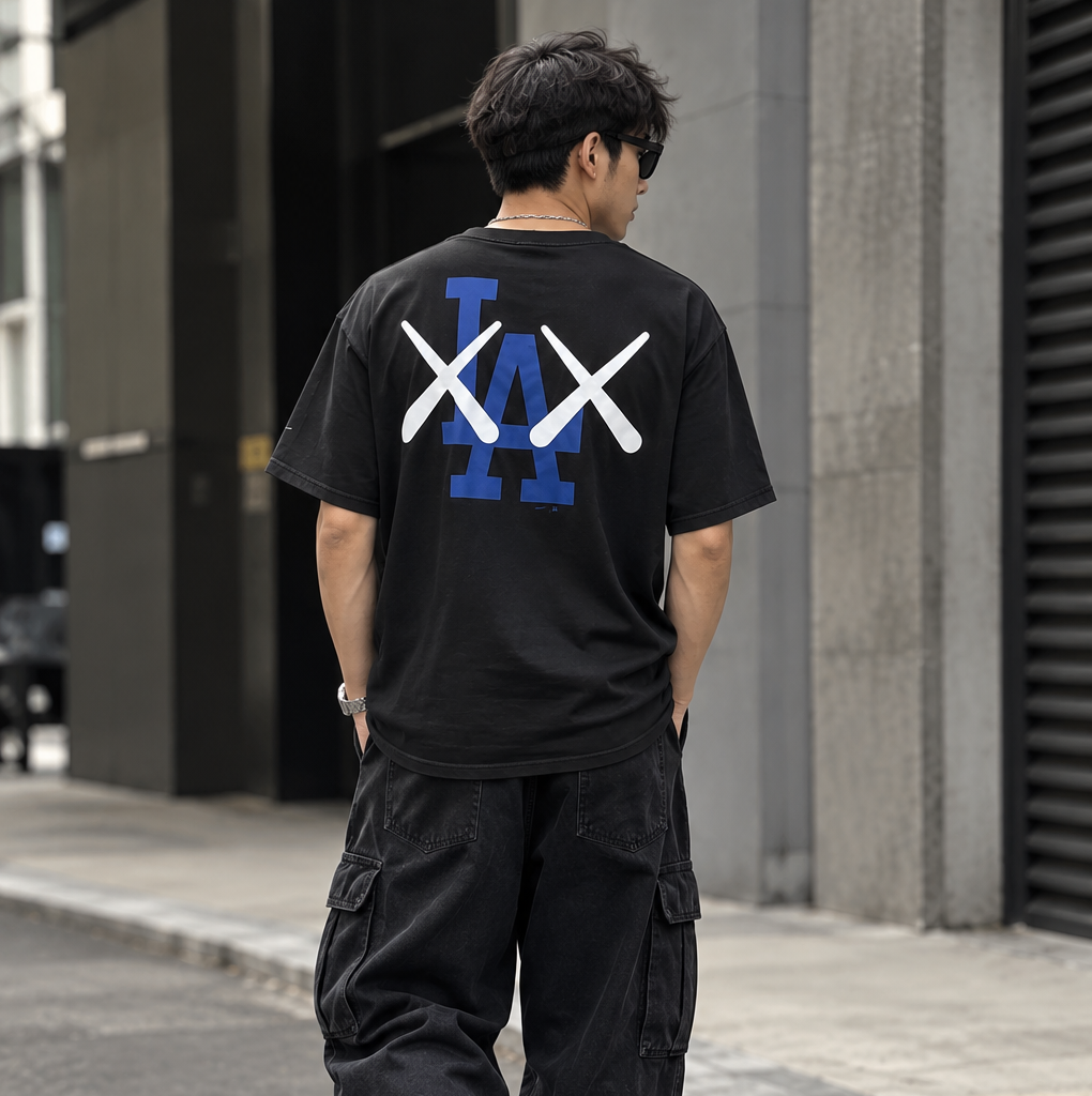 Black MLB X KAWS X Nike Los Angeles Dodgers tee featuring unique graphic design and casual fit from HUMAN MADE apparel.