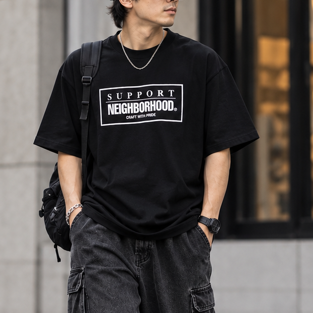 Black NEIGHBORHOOD SS-7 Tee shirt with a simple crew neck and logo design, displayed flat on a white background.
