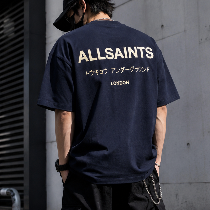 AllSaints Underground Logo Tee in MoonLit Blue, casual men's t-shirt with printed logo on front, soft fabric, and comfortable fit.