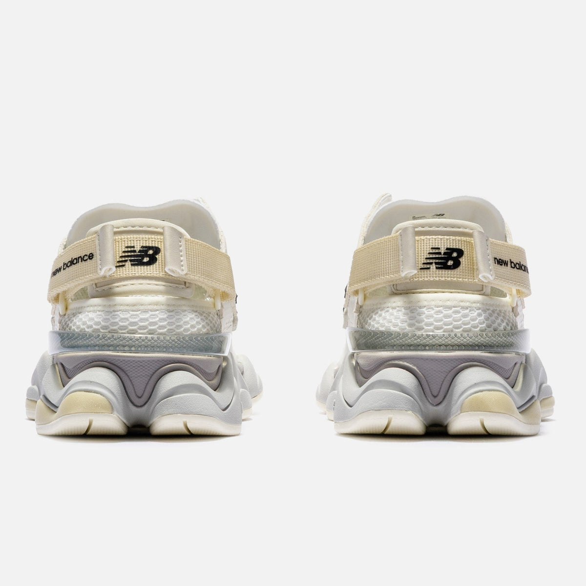 New Balance 9060 Mule sneakers in off-white and mauve with a sleek, modern design and comfortable fit.