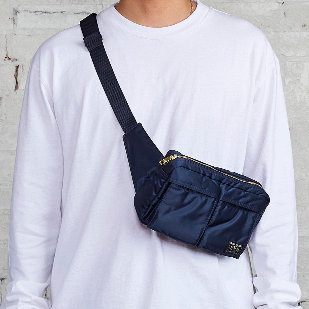 Porter Yoshida Japan Tanker Waist Bag in iron blue with multiple pockets and adjustable strap, stylish and functional bag.