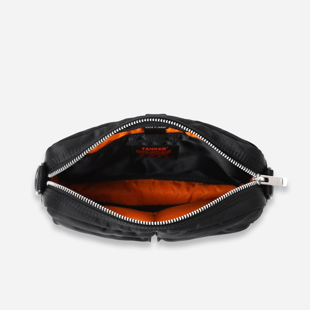Black Porter Yoshida Japan Tanker Sling Bag with adjustable strap and compact design, ideal for everyday carry.