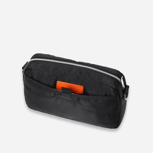 Black Porter Yoshida Japan Tanker Sling Bag with adjustable strap and multiple compartments, stylish and durable for everyday use.