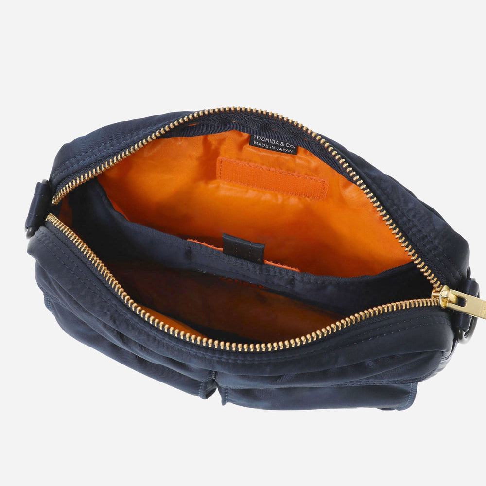 Navy Porter Yoshida Japan Tanker Shoulder Bag with adjustable strap and durable fabric, featuring subtle branding and sleek design.