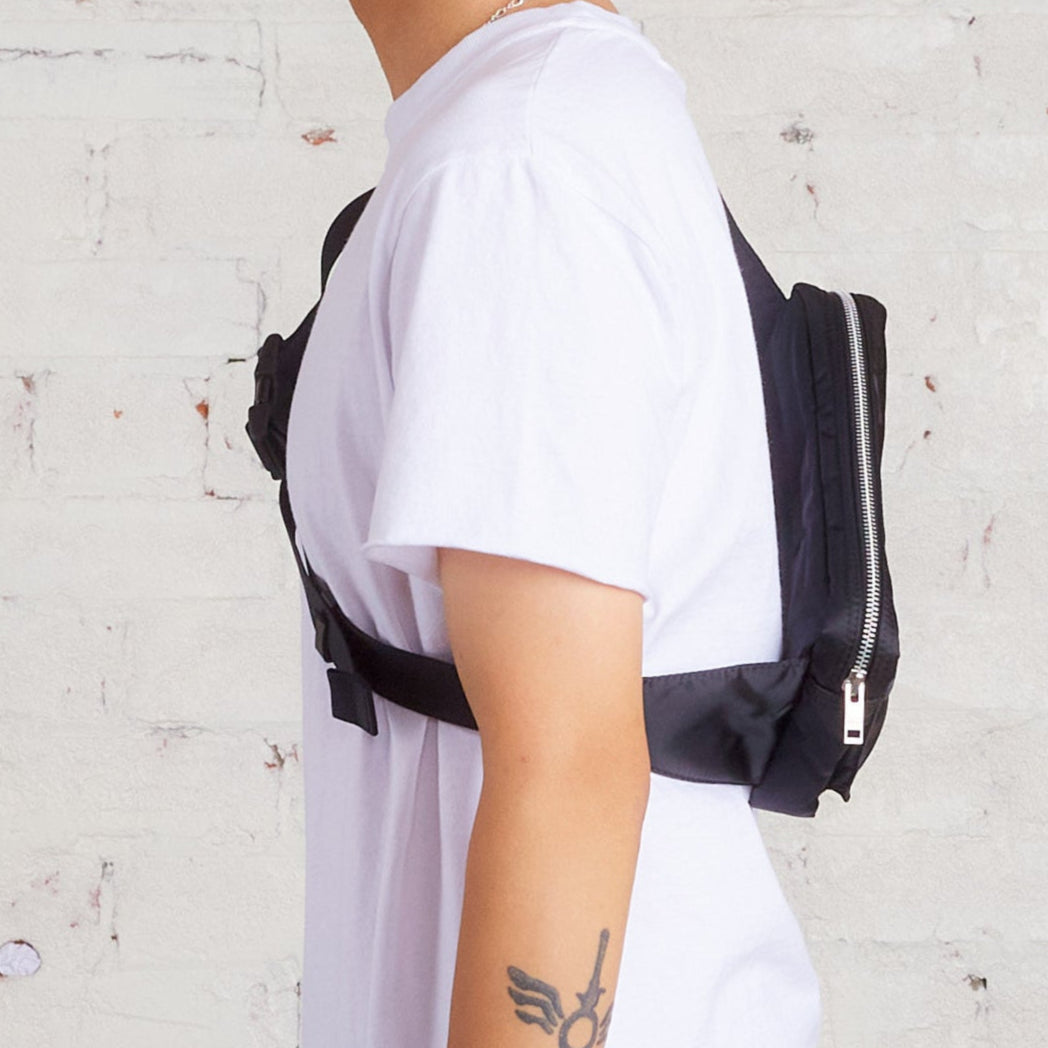 Black Porter Yoshida Japan Tanker Waist Bag with adjustable strap and multiple compartments for convenient carry.