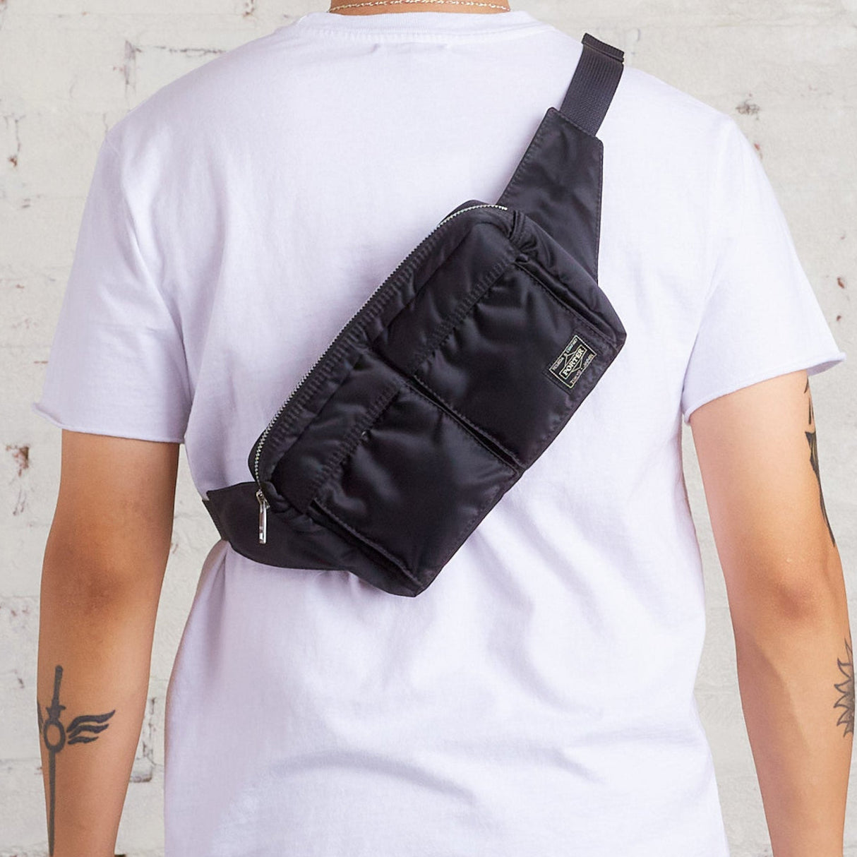 Black Porter Yoshida Japan Tanker Waist Bag with adjustable strap and multiple compartments, stylish and functional for everyday use.