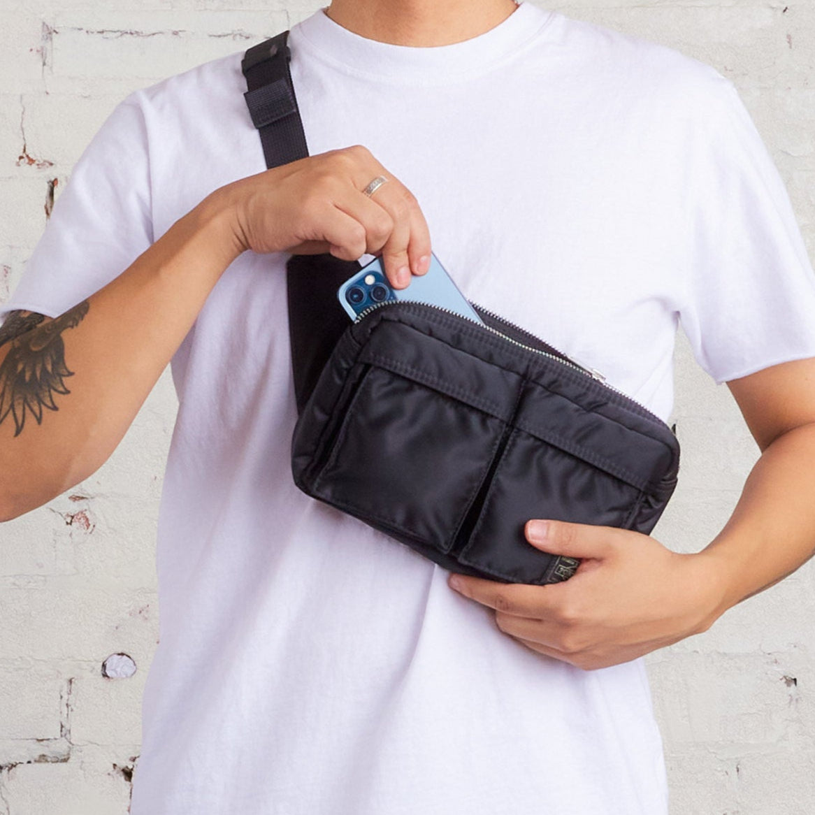 Black Porter Yoshida Japan Tanker waist bag with adjustable strap and multiple compartments, casual and functional bag for everyday use.