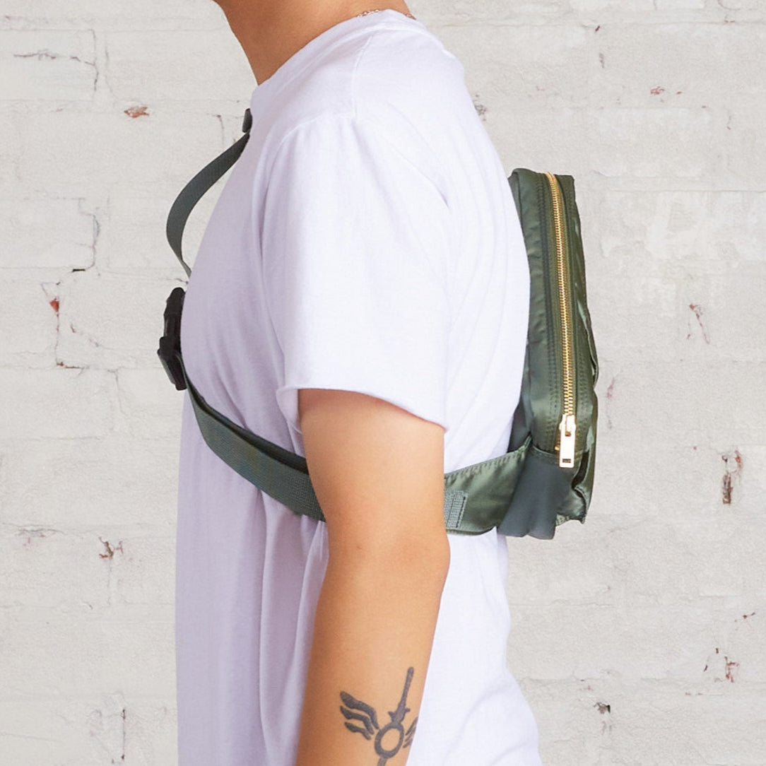 Porter Yoshida Japan Tanker Waist Bag in sage green with multiple pockets and adjustable strap, stylish and functional accessory.