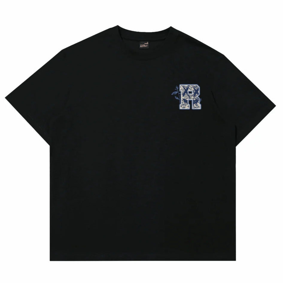 Black Rickyisclown embroidered smiley face tee with blue and white porcelain patch, casual apparel by Rickyisclown.