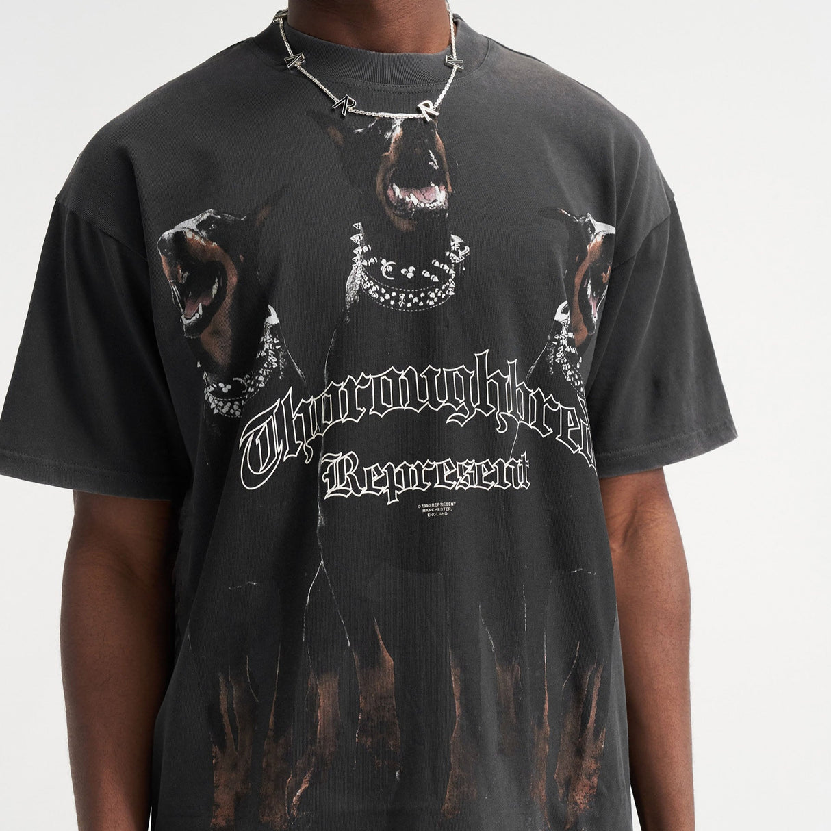 Black REPRESENT Thoroughbred Tee displayed flat, showcasing the classic crew neck and soft cotton fabric.