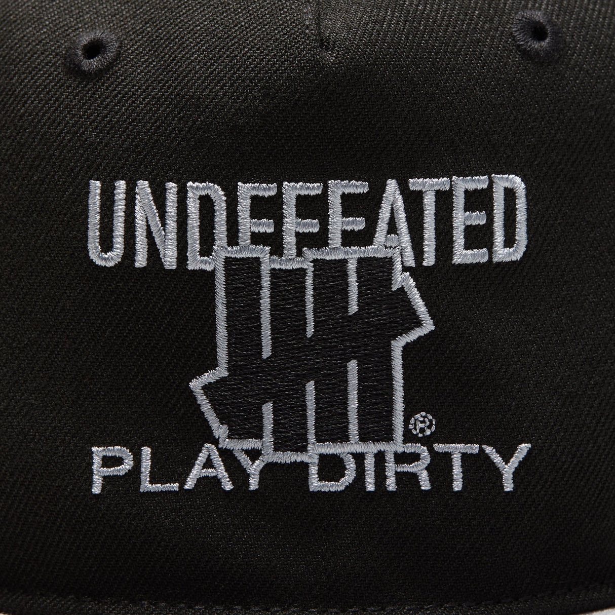 Black Undefeated Play Dirty snapback hat with adjustable strap and embroidered logo, stylish headwear for casual wear.