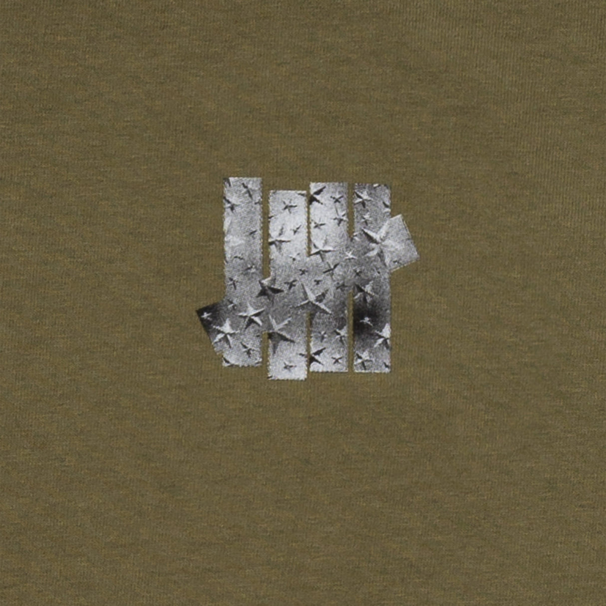 Olive Undefeated Foil Photo Logo T-shirt showing a silver foil logo graphic on the front, casual short-sleeve apparel.