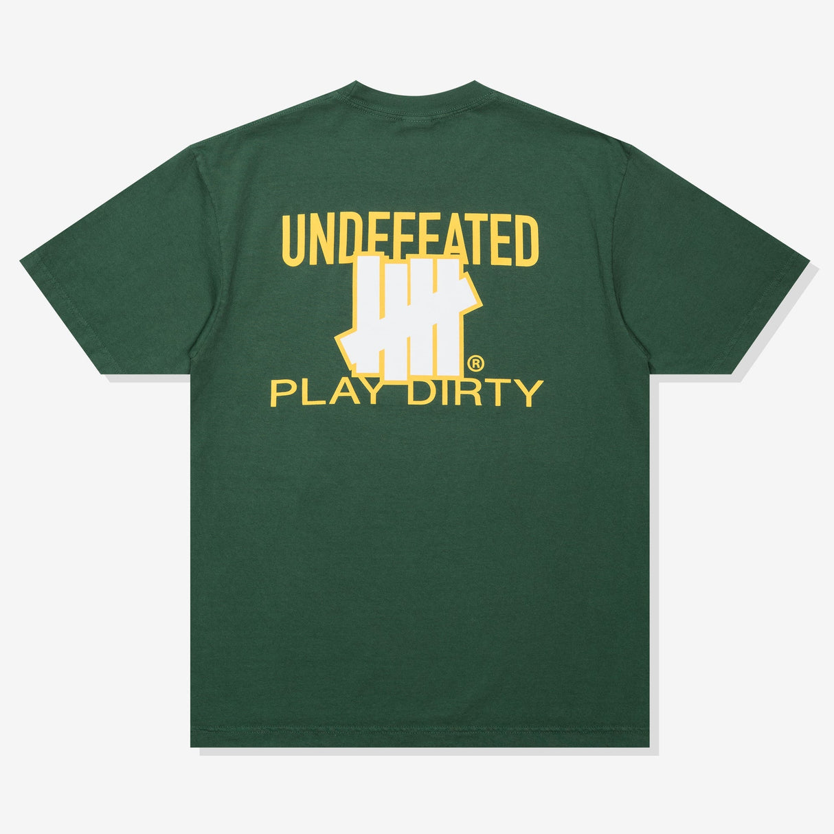 Forest green UNDEFEATED Trademark Tee featuring a classic logo on the front, displayed on a casual apparel model.