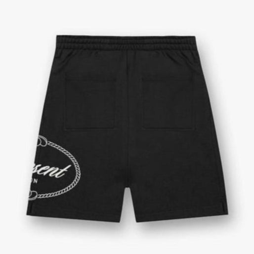 Black crest shorts by REPRESENT, featuring Harrods branding and stylish design, shown on a model against a neutral background.