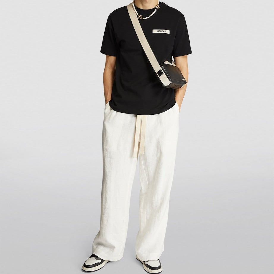 Black Jacquemus Grosgrain Logo Tee from MASTERMIND JAPAN, featuring a casual fit with prominent logo detailing on the front.