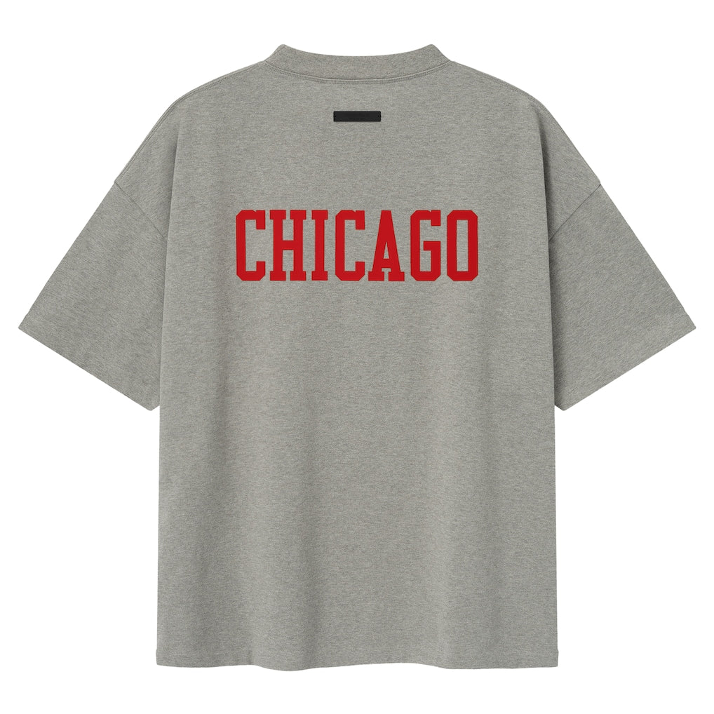 Fear of God Essentials NBA Chicago Bulls 90s heavyweight unisex T-shirt in concrete with Bulls logo and vintage style.