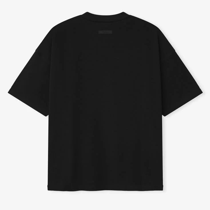Fear of God Essentials Reflective Logo 90s Tee in black, featuring a reflective logo print on the front, casual apparel for streetwear style.