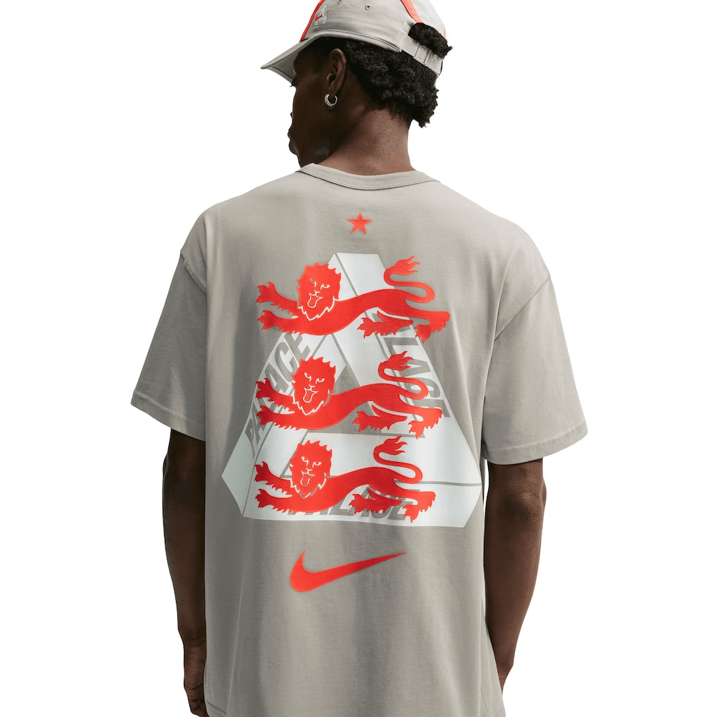 Nike Palace x England T-shirt in Pewter Grey, featuring England and Nike branding, displayed on a flat surface.