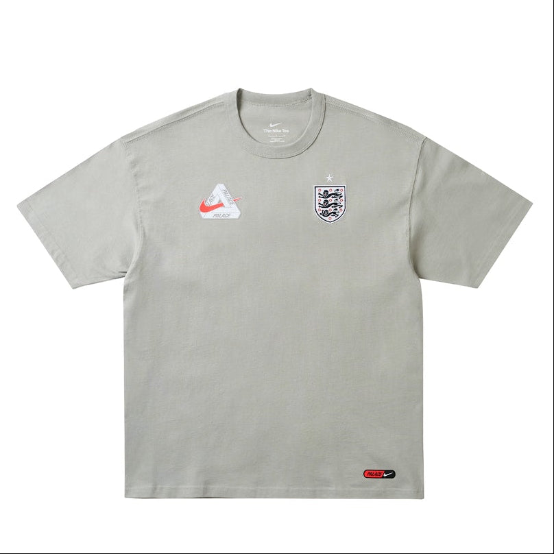 England Nike x Palace premium T-shirt in pewter grey featuring Nike branding and England graphic design.