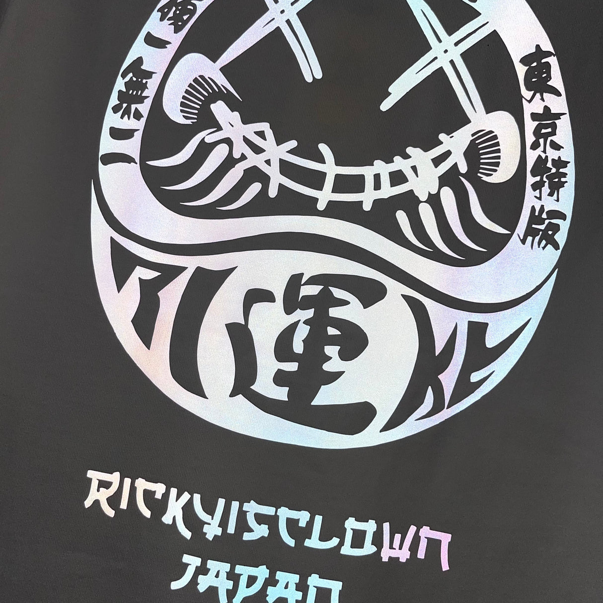 White Rickyisclown Japan Lucky Daruma laser reflective tee shirt featuring bold Daruma design and reflective details.