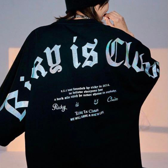Black Rickyisclown holographic gothic drop shoulder tee shirt with long sleeves and unique reflective design.