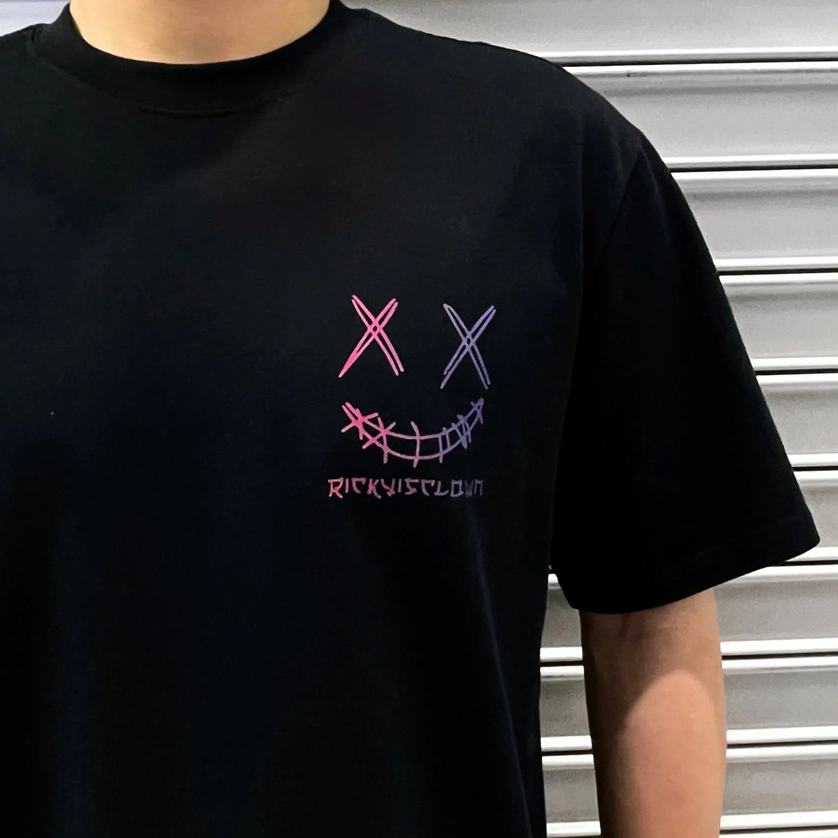 RICKYISCLOWN Japan Lucky Daruma laser reflective black tee shirt with bold graphic design, casual apparel for streetwear style.