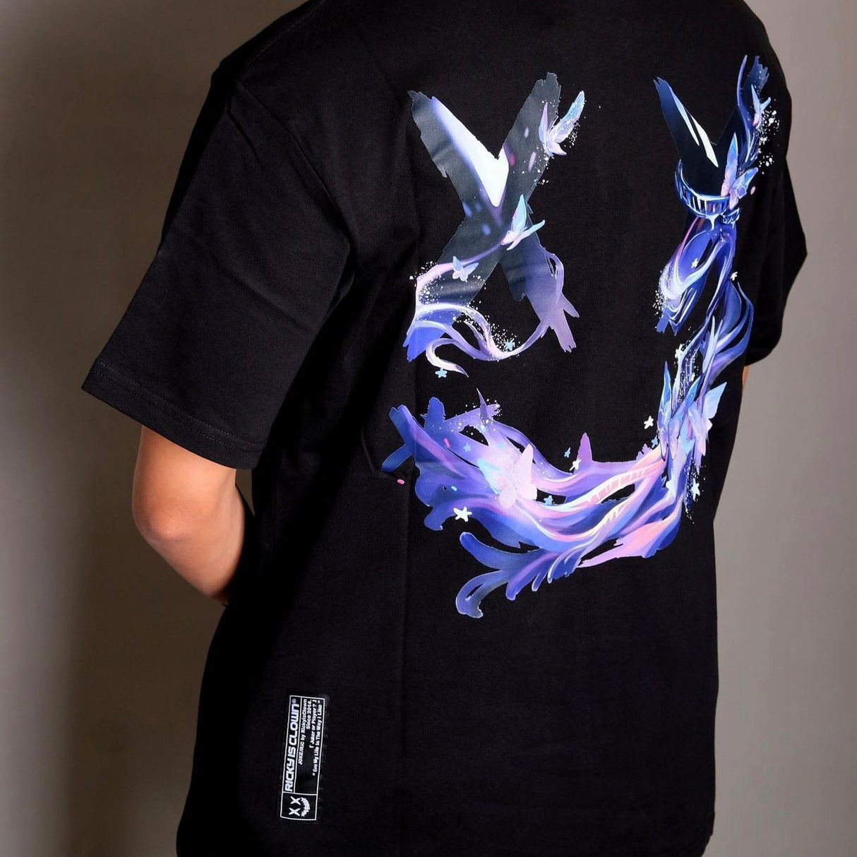 Black Rickyisclown Mystical Butterfly Tee featuring a colorful butterfly graphic on the front, casual apparel for everyday wear.