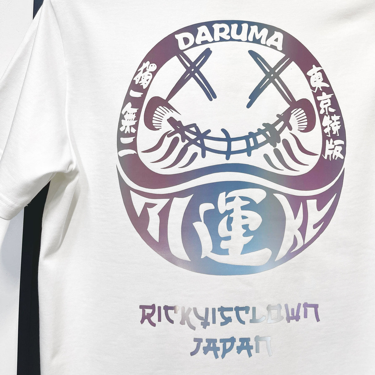 White Rickyisclown Japan Lucky Daruma laser-reflective T-shirt with bold Daruma design, casual apparel from Rickyisclown brand.