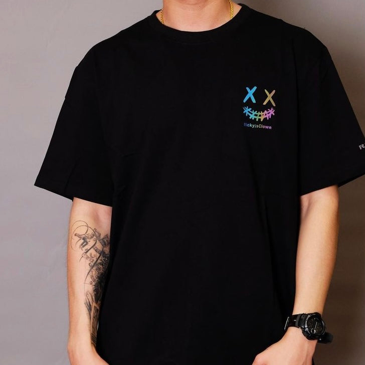 Black Rickyisclown Basic Reflective Smiley Tee with a bright reflective smiley design on the front.