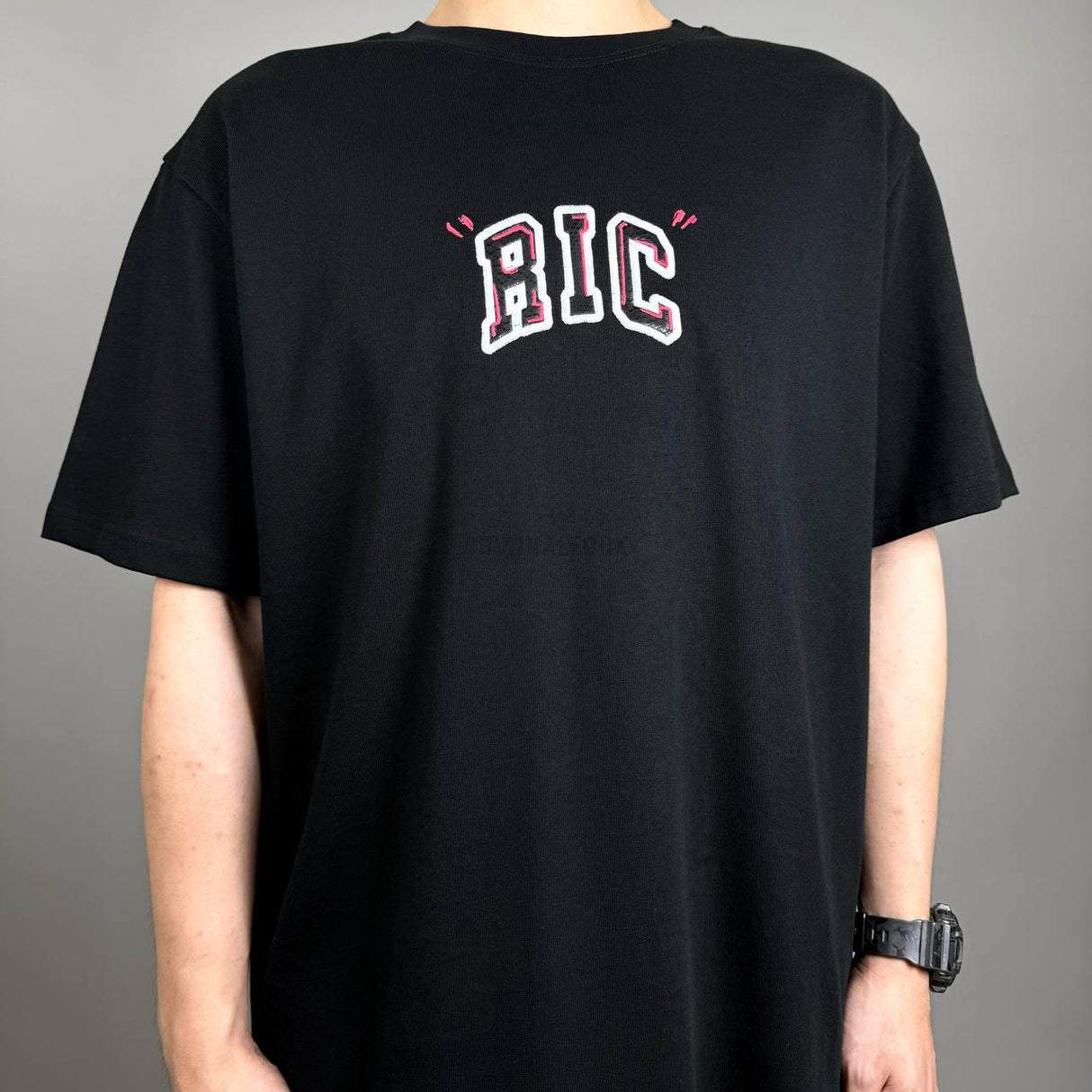 Black Rickyisclown Big Embossed Snake Tee, casual apparel with bold snake design on front, from the Rickyisclown brand.