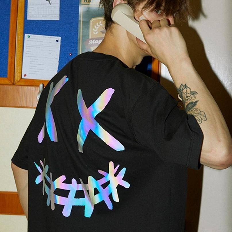 Rickyisclown Basic Reflective Smiley Tee in black with holographic reflective smiley design, casual apparel by RICKYISCLOWN.