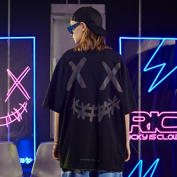 Rickyisclown Basic Reflective Smiley Tee in black with holographic reflective smiley design, casual apparel by RICKYISCLOWN.