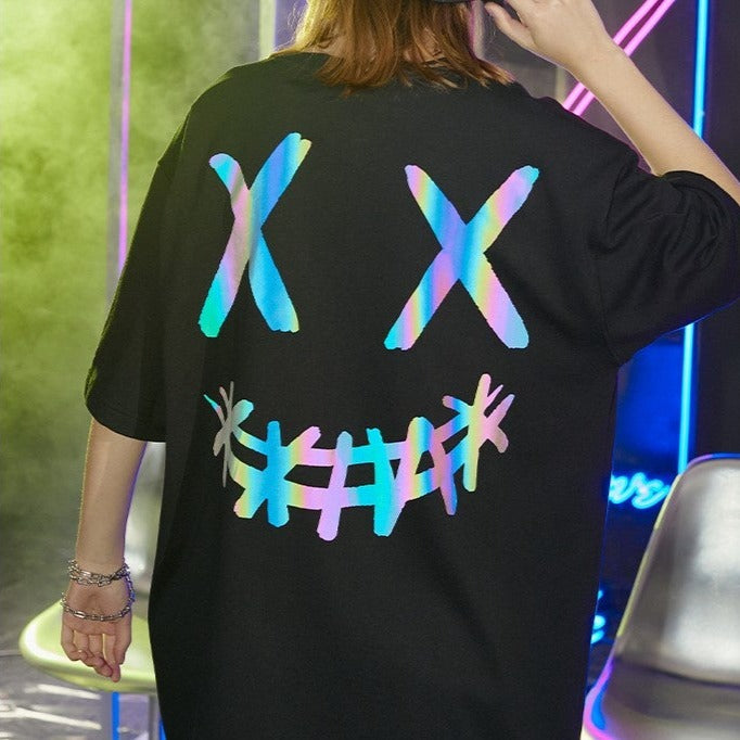 Black Rickyisclown Reflective Smiley Tee featuring a holographic smiley face design on soft cotton fabric.
