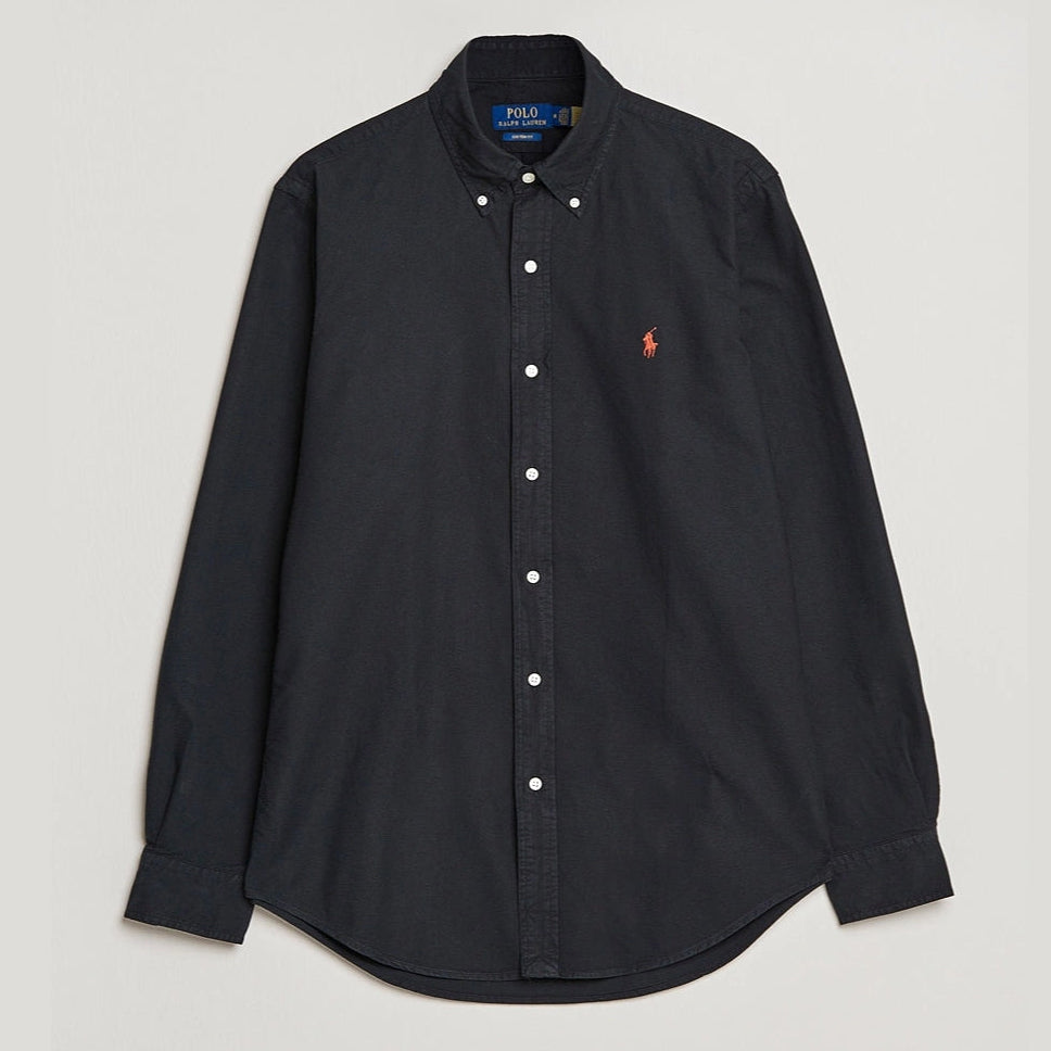 Black Polo Ralph Lauren classic fit Oxford long sleeve shirt displayed on a hanger, showcasing its tailored collar and button-down front.