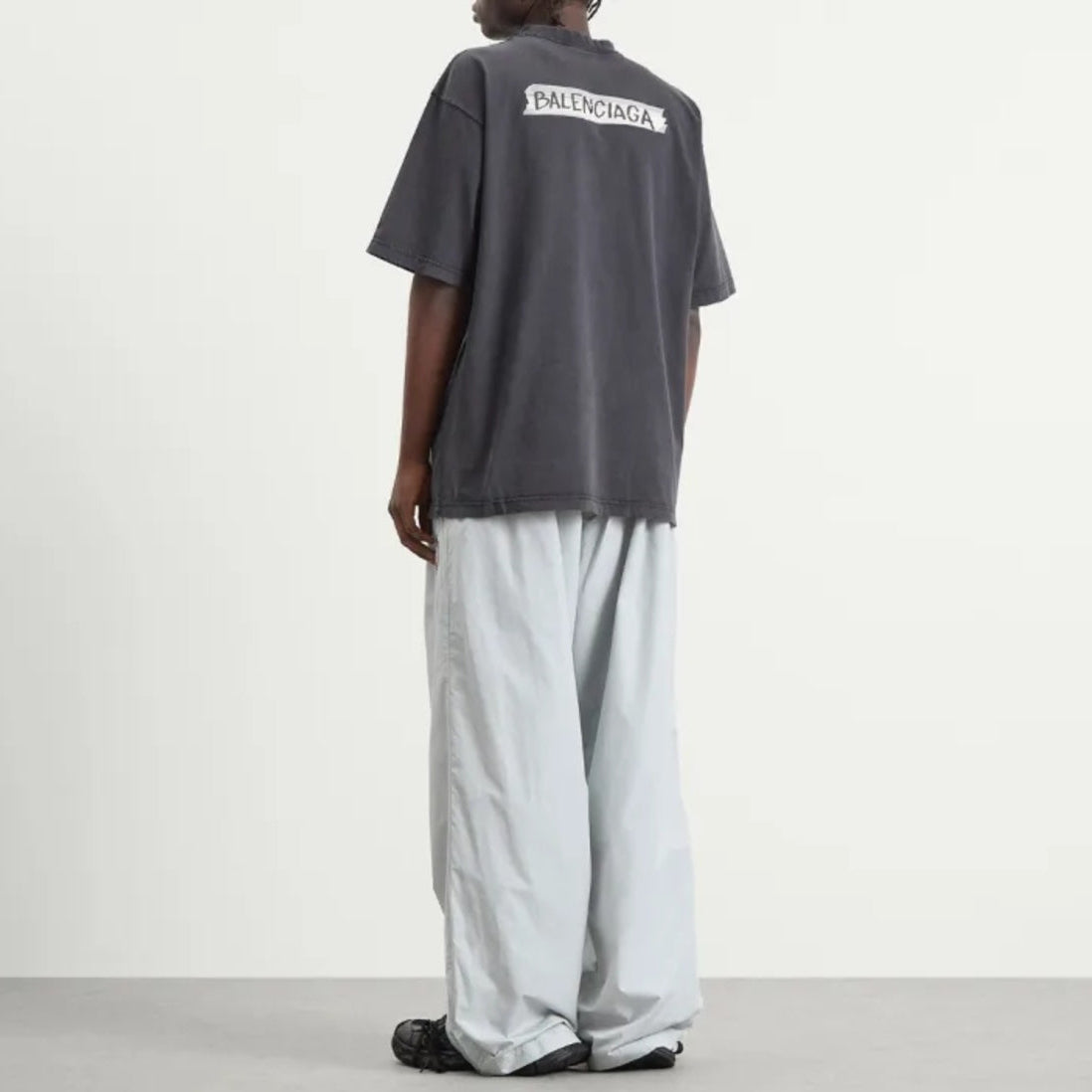 Black Balenciaga Masking Tape Tee, casual apparel with bold graphic design, displayed flat on a white background.