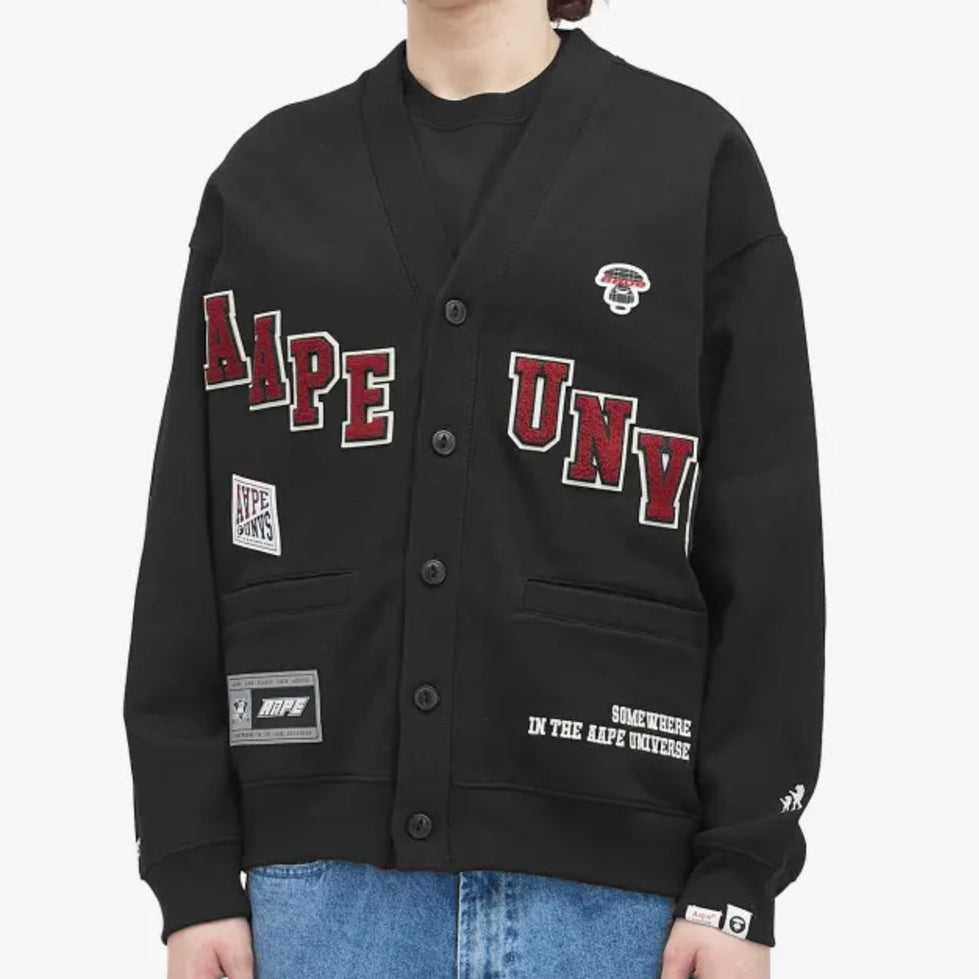 AAPE by BATHING APE UNVS cardigan, stylish knitwear, featuring the brand's logo and a modern design, displayed on a mannequin.