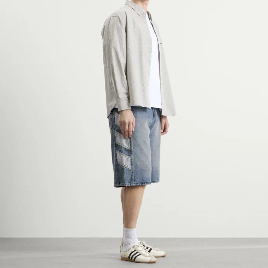 Adidas denim shorts in indigo color with classic five-pocket design and belt loops, casual apparel for warm weather.