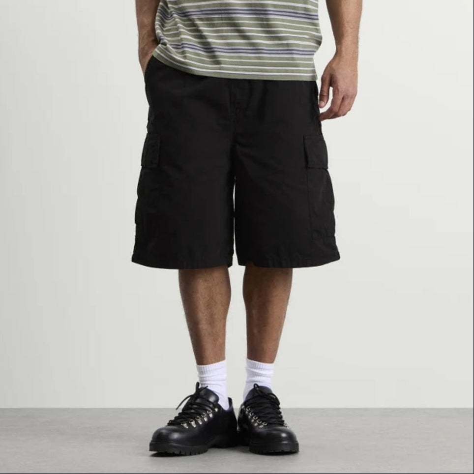Black Carhartt WIP Mandler Cargo Shorts shown on a model, featuring multiple pockets and durable fabric for casual wear.