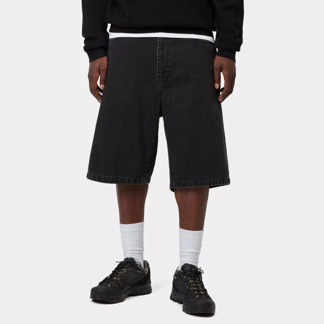 Black stone wash Carhartt WIP Landon loose denim shorts displayed on a hanger, showcasing their relaxed fit and casual style.