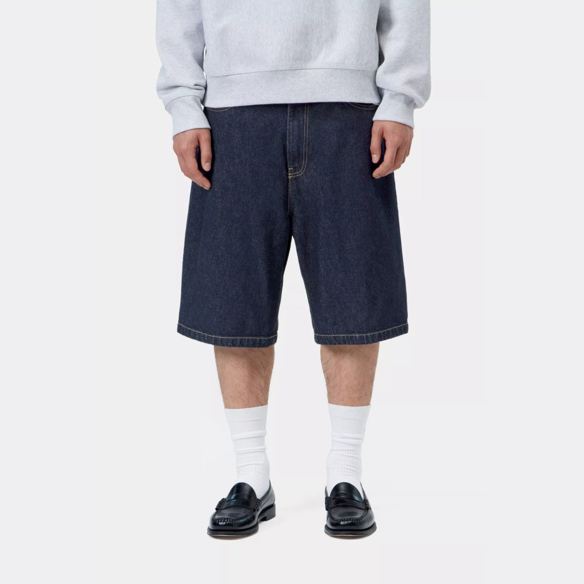 Carhartt WIP Landon loose fit denim shorts in blue rinse, casual men's apparel, showing the relaxed fit and distressed details.