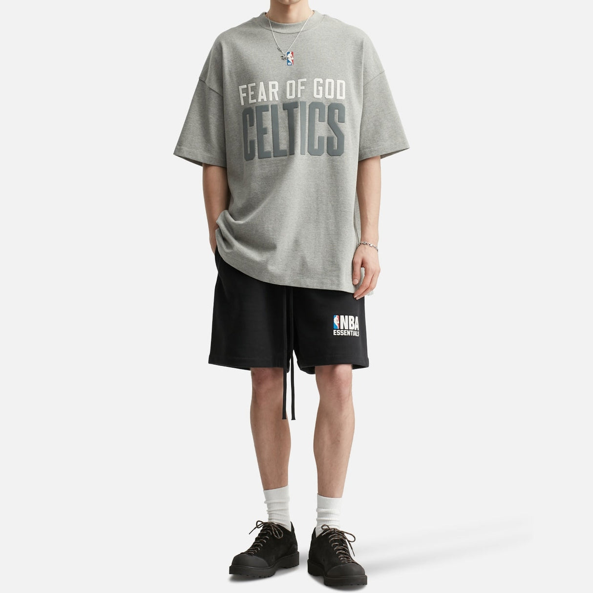 Fear of God Essentials NBA Celtics 90s heavyweight tee in concrete, featuring team logo and vintage-inspired design.