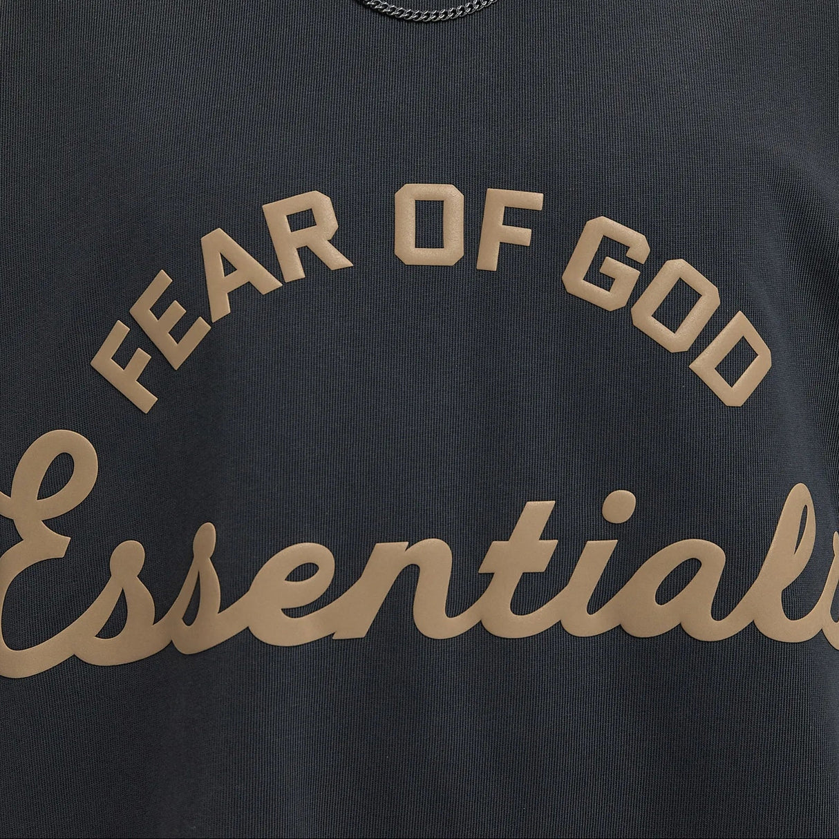 Fear of God Essentials Training 90s Heavyweight Tee in Iron Grey, square image showing the casual, oversized sweatshirt with logo details.