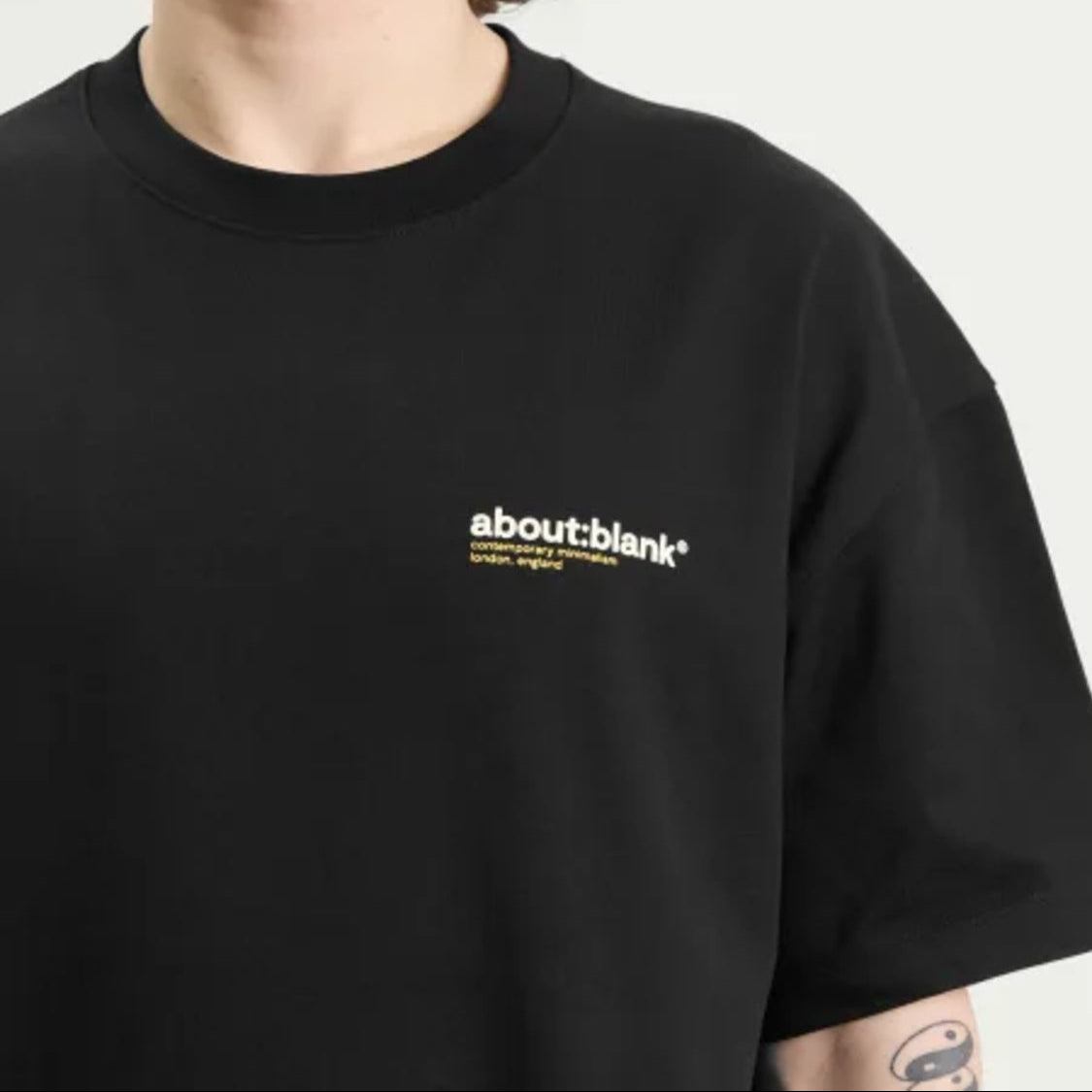 Black AboutBlank Collection Tee from ABOUT:BLANK, showcasing a casual T-shirt with a simple, stylish design.