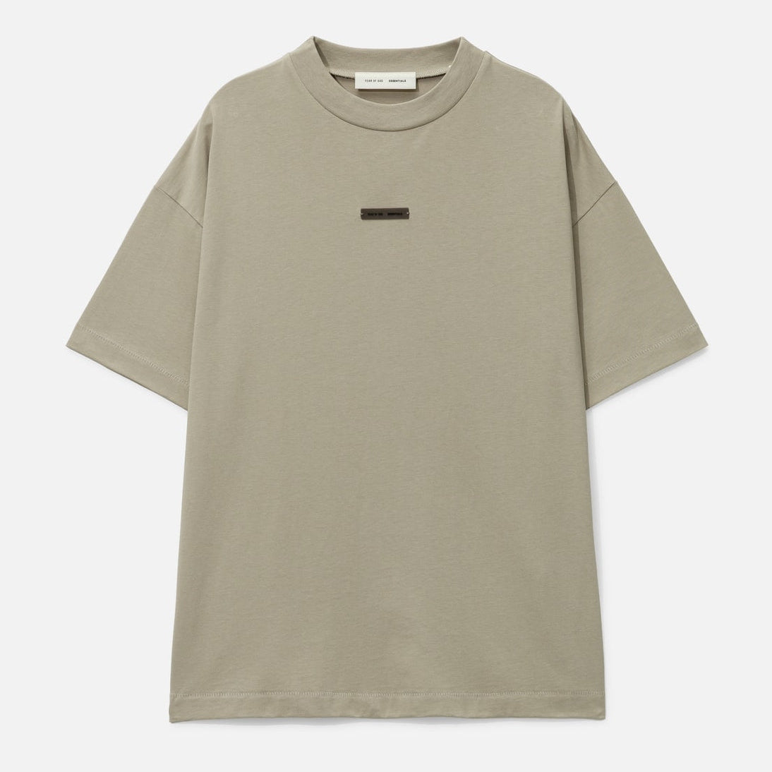 Fear of God Essentials metallic logo classic fit tee in Abbey Stone, showcasing a casual men's t-shirt with a metallic brand logo detail.