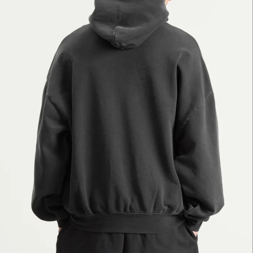 Fear of God Essentials Training 90s Heavyweight Hoodie in iron gray, featuring a relaxed fit and branding details.